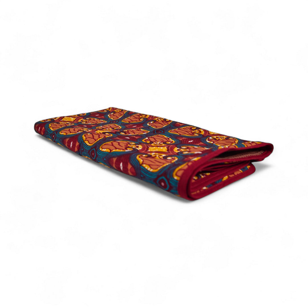 Cape de bain bébé MALAIKA en wax de coton doublé de piqué de coton gaufré nid d'abeille bois de rose. 88 x 88 cm.