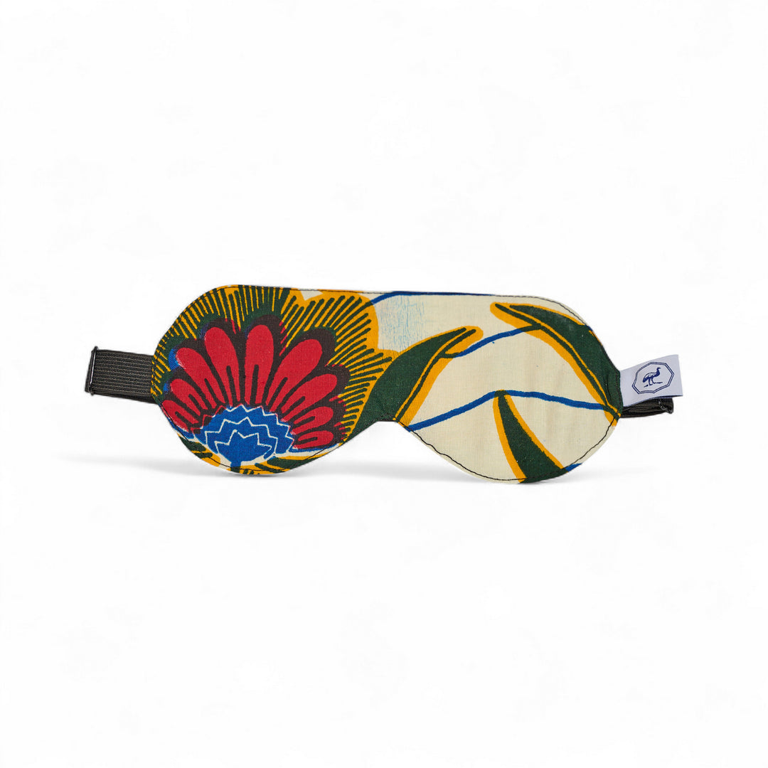 Masque de nuit wax et soie DARE – motif wax floral rouge et jaune et bleu sur fond ivoire