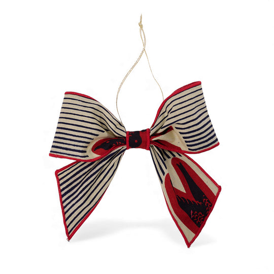 Nœud décoratif de Noël ZAWADI en wax rayé MTOTO beige, rouge et bleu marine, pièce artisanale réalisée avec des chutes de tissu, Studio Matongé.