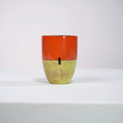 Mug MMOHO en céramique par la céramiste Sud-Africaine Clementina van der Walt pour Done d'Africa x Studio Matongé.
8 cm de diamètre et 11,5 cm de hauteur, parfait pour vos grands cafés, thés et infusions. 
Ici en combinaison Orange Sunset & Pistache
